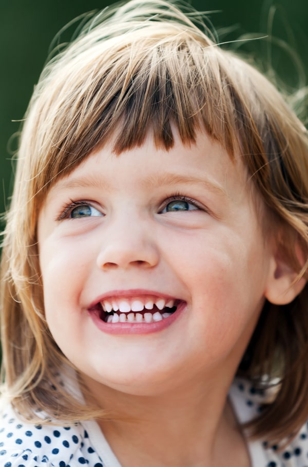Give Your Child the Best Start – Explore Orthodontics for Children Today! A girl is happily smiling