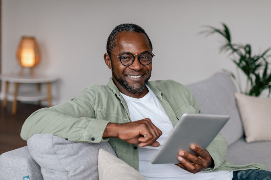 Start Your Journey to a Beautiful Smile! A man is joyfully smiling in the room