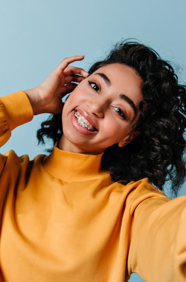 A woman is smiling