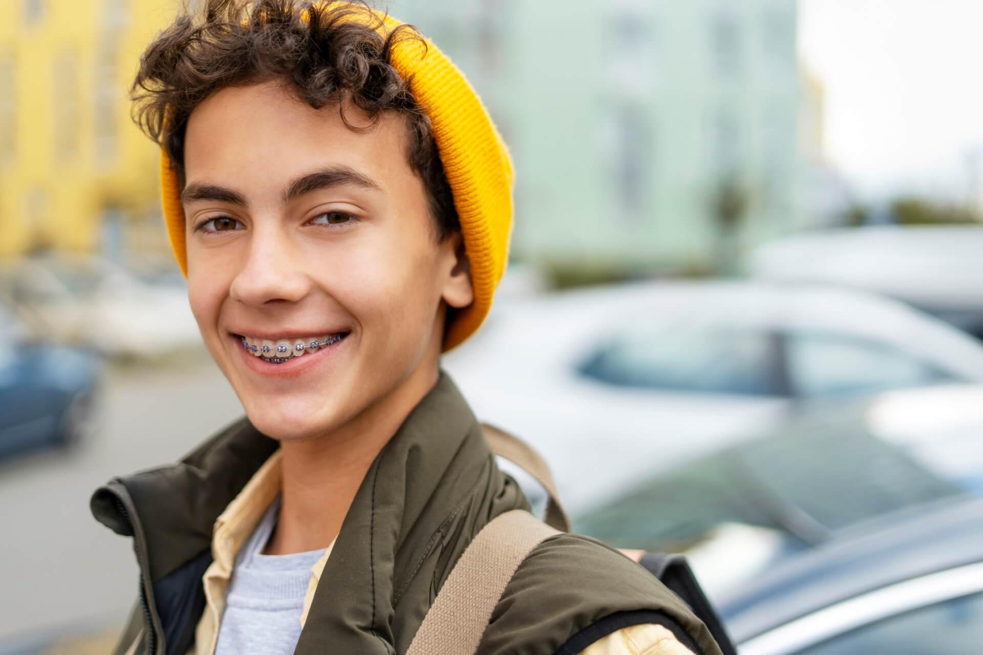 Boy with braces smiling